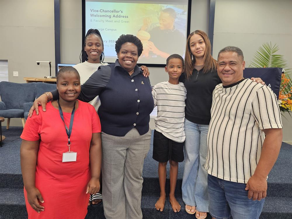 George Campus principal, Dr Kaluke Mawila, gave the first-years a hearty welcome. Here she is with three students: Mabona Yola (from Flagstaff, registered for the management diploma), Olwethu Mazibuko (Bergville, KZN, enrolled for BCom), and Yarka Carolus (from Robertson, enrolled for the management diploma) with her father, Heinrich, and brother, Savea.